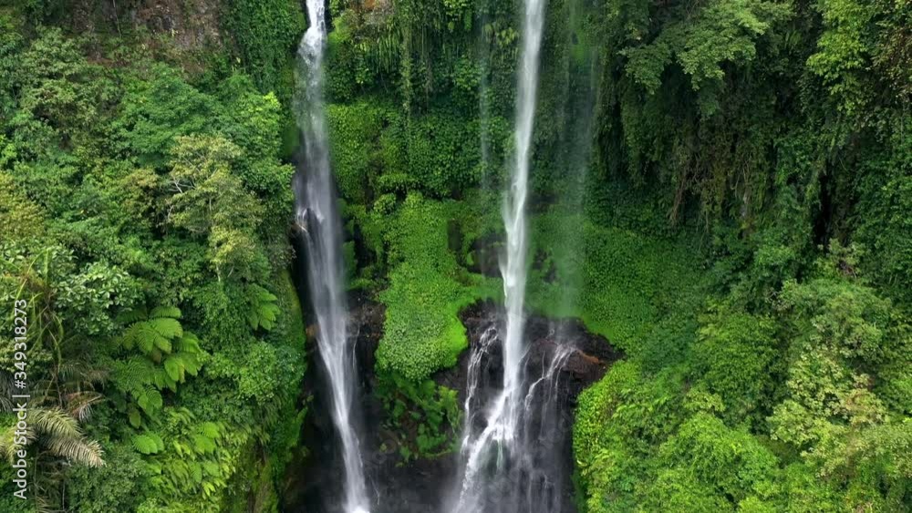 aerial shot of high waterfall in deep forest 4k aerial shot of high waterfall in deep forest 4k
