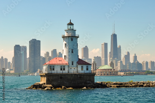 Chicago skyline behind lake michigan lighthouse