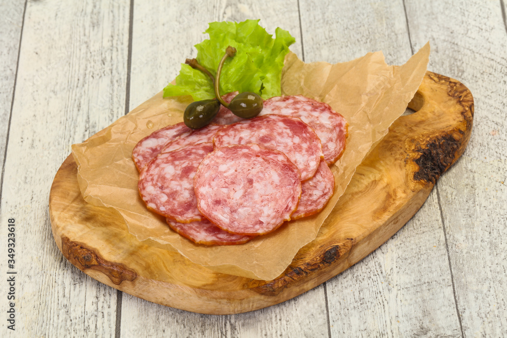 Spanish Salchichon sausage with salad Spanish Salchichon sausage with salad
