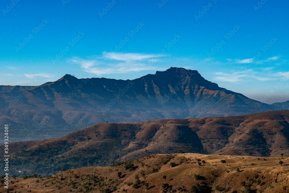 Torna Fort (First fort captured by shivaji maharaj) view from Pabe ghat with big mountains and blue sky, Pune, Maharashtra,India, 1st January 2020