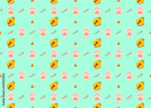 Kitten claw with yellow small bell seamless pattern on light blue background.