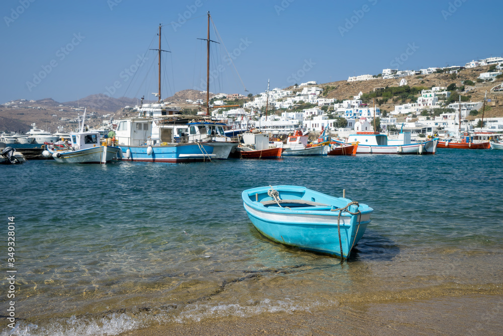 Scenic view of the old town on the Greek island of Mykonos. Fishing boats on the background of the sea and white houses