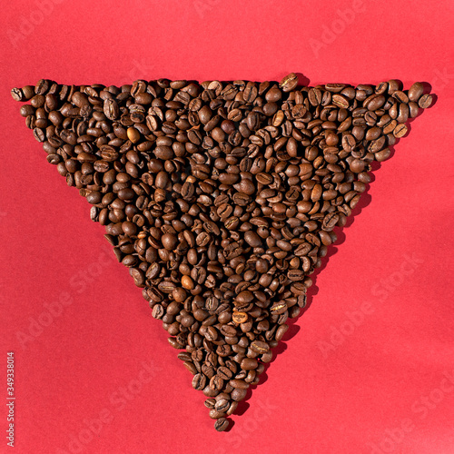 Coffee beans on a red background