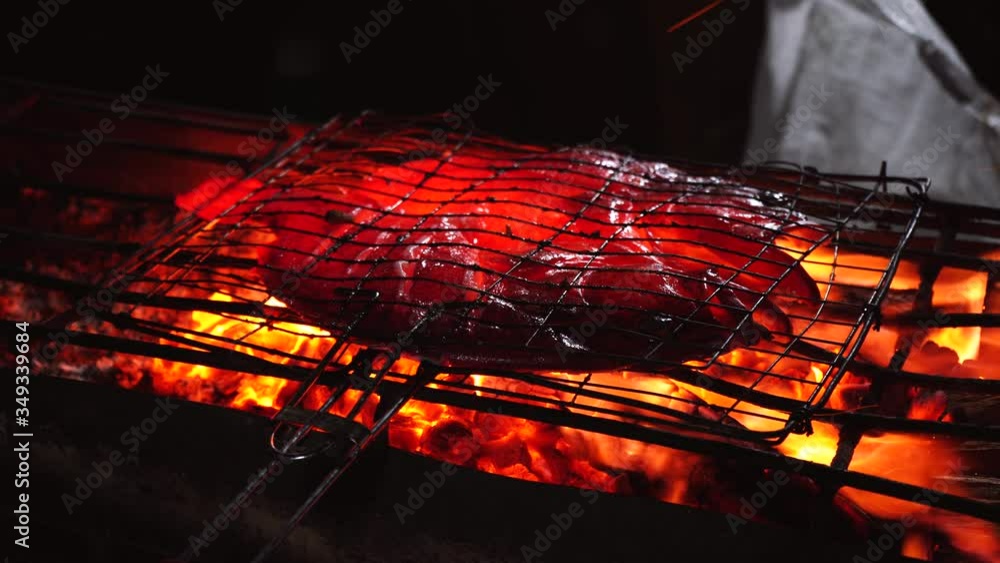 grilling a fish on the fire grilling a fish on the fire