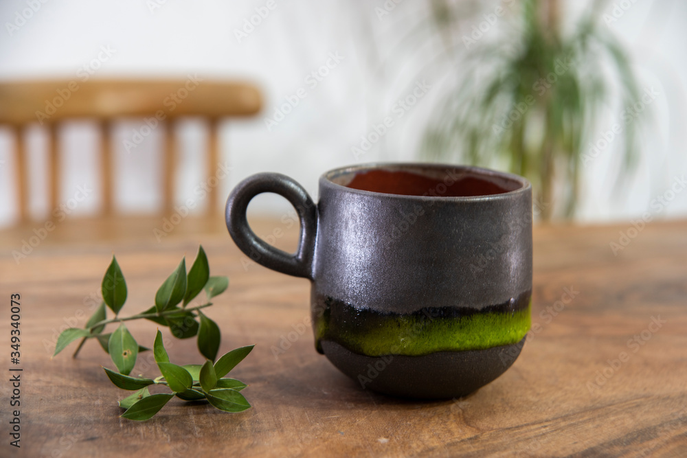colorful handmade ceramic coffee cup on wooden table colorful handmade ceramic coffee cup on wooden table