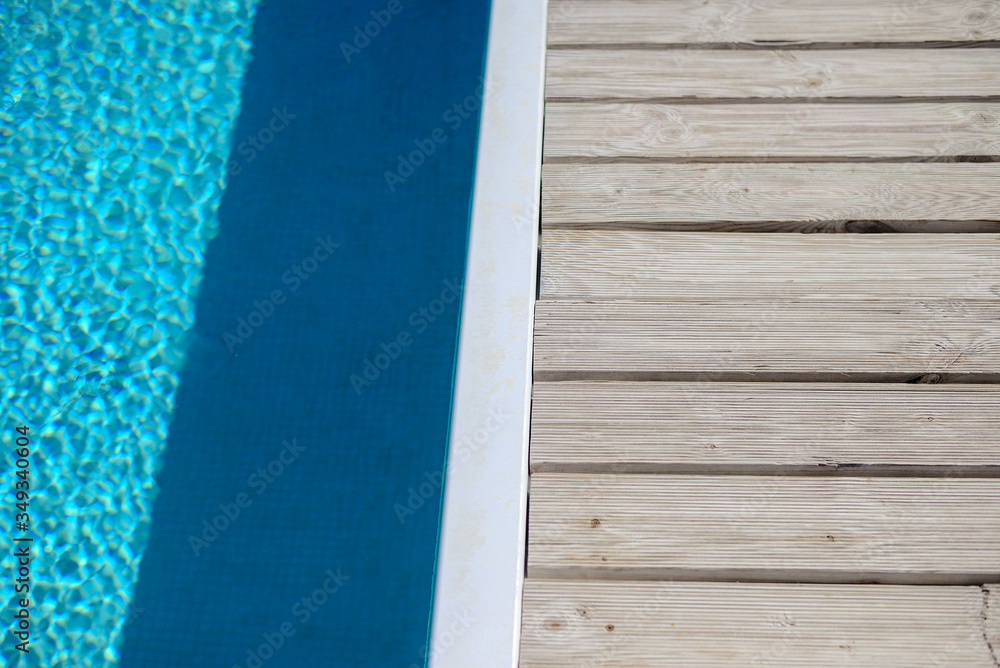 Swimming pool side with blue water background