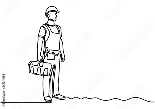 Single continuous line drawing of young handyman wearing building construction uniform while holding box tools. Home maintenance service excellent concept. Isolated draw design vector illustration