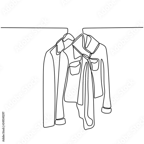 One line drawing of blouse, suits, shirt, and t-shirt hanging on rack for sale in store. Minimalistic style of fashionable business clothes. Continuous vector background with clothes and hangers.