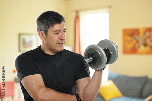 Mature man workingout at home