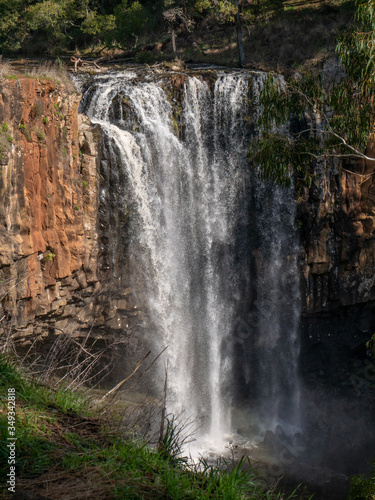 Trentham Falls, Melbourne on sunny day person waterfall