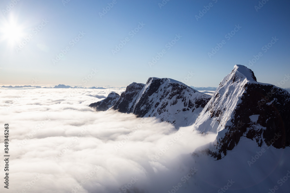 Obraz premium Aerial View of Remote Canadian Mountain Landscape during sunny sunrise. Located near Vancouver, British Columbia, Canada. Nature Background. Authentic