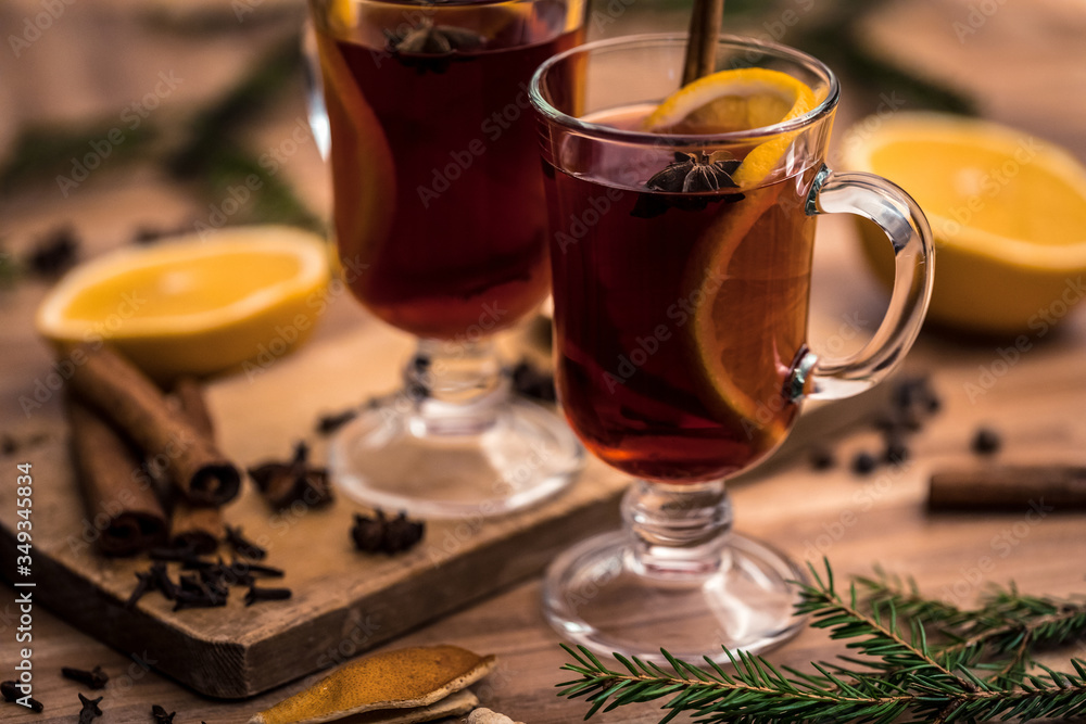 mulled wine with spices on a wooden table mulled wine with spices on a wooden table