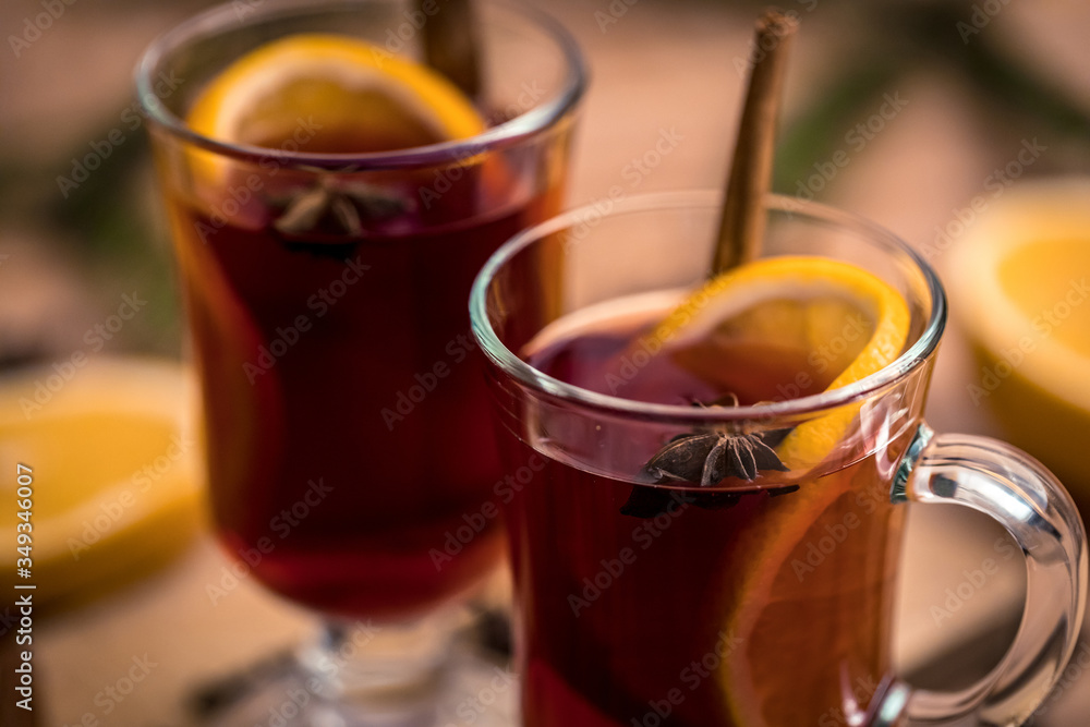 mulled wine with spices on a wooden table mulled wine with spices on a wooden table