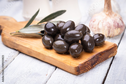 Fotografie Pickled olives ready to eat, healthy food used in mediterranean cuisines