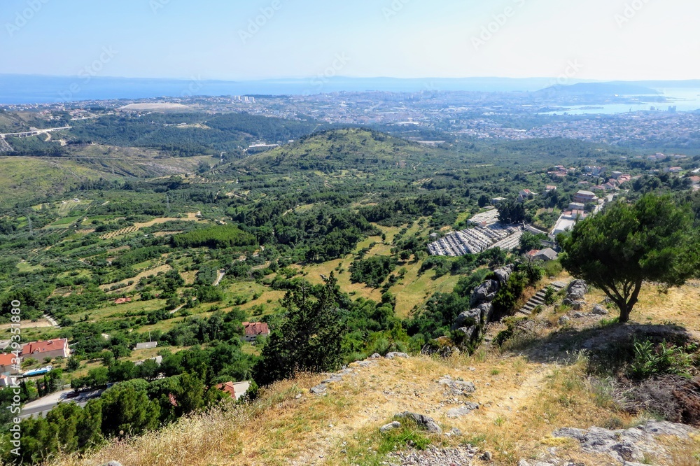 A beautiful view of a valley full of farmland outside of Split, Croatia in Klis.  The view is high above from the Klis fortress.