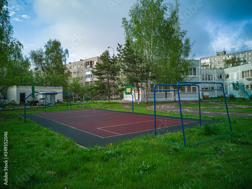 Wallpaper Mural Sports ground in courtyard of residential complex. Public sports grounds for team games of sport, basketball, football, volleyball, handball in residential area, of educational institutions city Torontodigital.ca