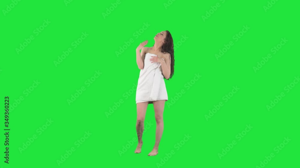 Young woman feeling uncomfortable hot waving hand to cool herself as hand fan. Full body isolated on green screen background. Young woman feeling uncomfortable hot waving hand to cool herself as hand fan. Full body isolated on green screen background.