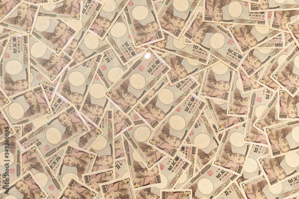 Japanese money - background with several notes of ten thousand yen (front). 10,000 yen notes. Concept: financial abundance. Horizontal shot.