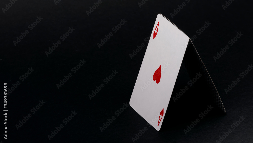House of cards isolated on black. Ace of hearts on black