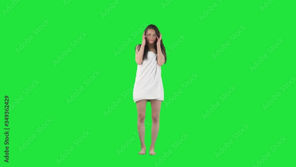 Attractive young woman in bathroom suffering from migraine or headache. Full body isolated on green screen background. Attractive young woman in bathroom suffering from migraine or headache. Full body isolated on green screen background.