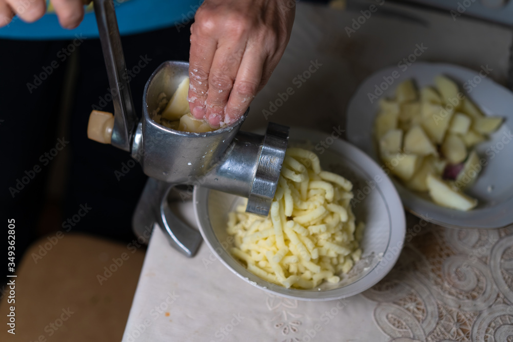 Manual meat grinder chopping potatoes Manual meat grinder chopping potatoes