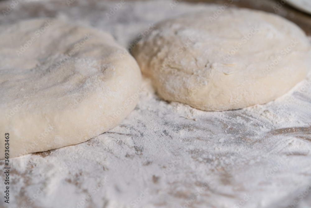 Cooked dough lies on flour for further baking