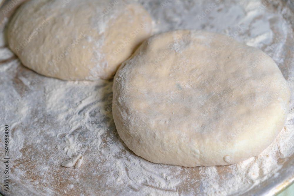 Cooked dough lies on flour for further baking Cooked dough lies on flour for further baking