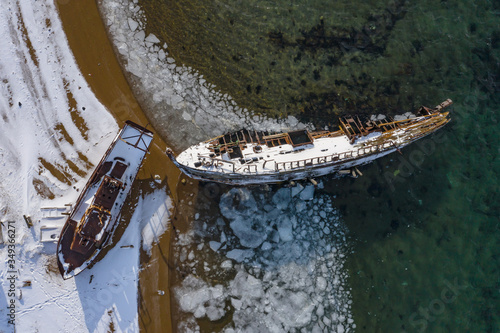 abandoned ships on the Barents sea coast photo