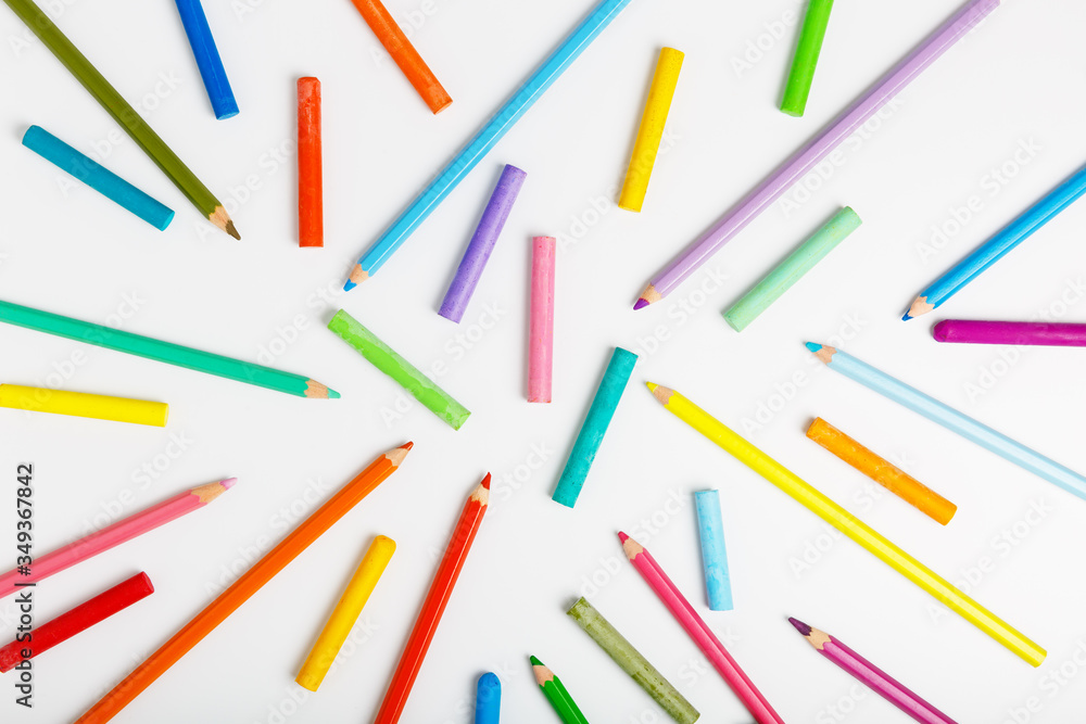 pattern of color pencils and pastel on a white background. Concept of drawing school for children. flat lay. pattern of color pencils and pastel on a white background. Concept of drawing school for children. flat lay.