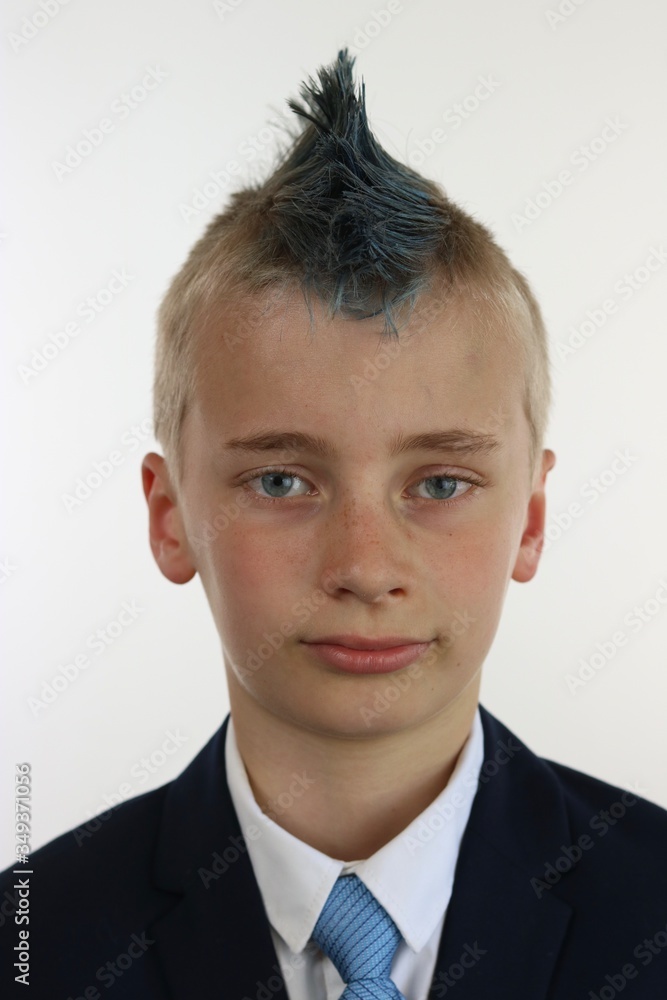 Portrait of a boy with a blue mohawk wearing a business suit Portrait of a boy with a blue mohawk wearing a business suit