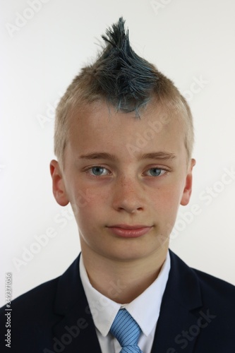 Canvastavla Portrait of a boy with a blue mohawk wearing a business suit