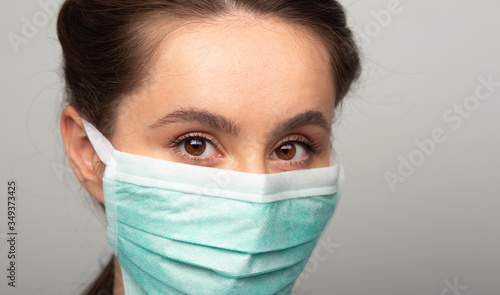 young woman with medical mask for corona
