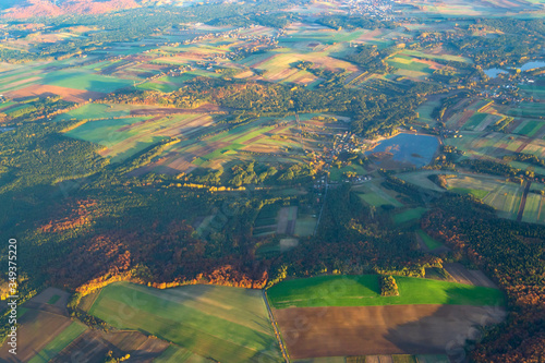 Aerial view background of Poland forests and hills in morning sunrise time. Autumn, Europe.