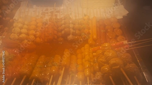 Thai meat skewer in a traditional Thai night market photo