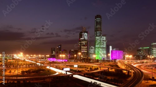 Time lapse: Aerial cityscape view during dusk overlooking King Abdullah Financial District in Riyadh city at skyline at sunset in Saudi Arabia. Dusk to night. photo