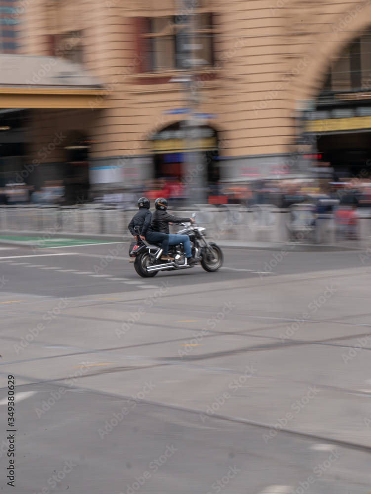 Motorbike driving fast through city