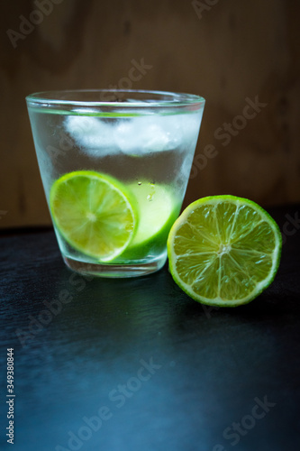 Lemon with a glass of water and ice