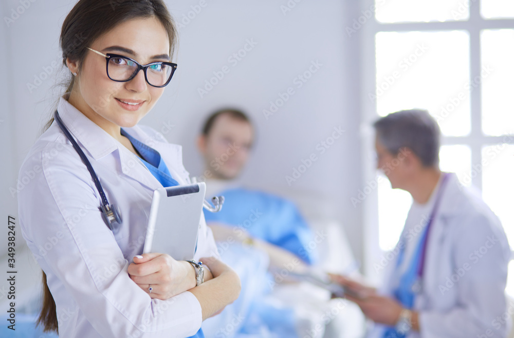 Female doctor using tablet computer in hospital lobby Female doctor using tablet computer in hospital lobby
