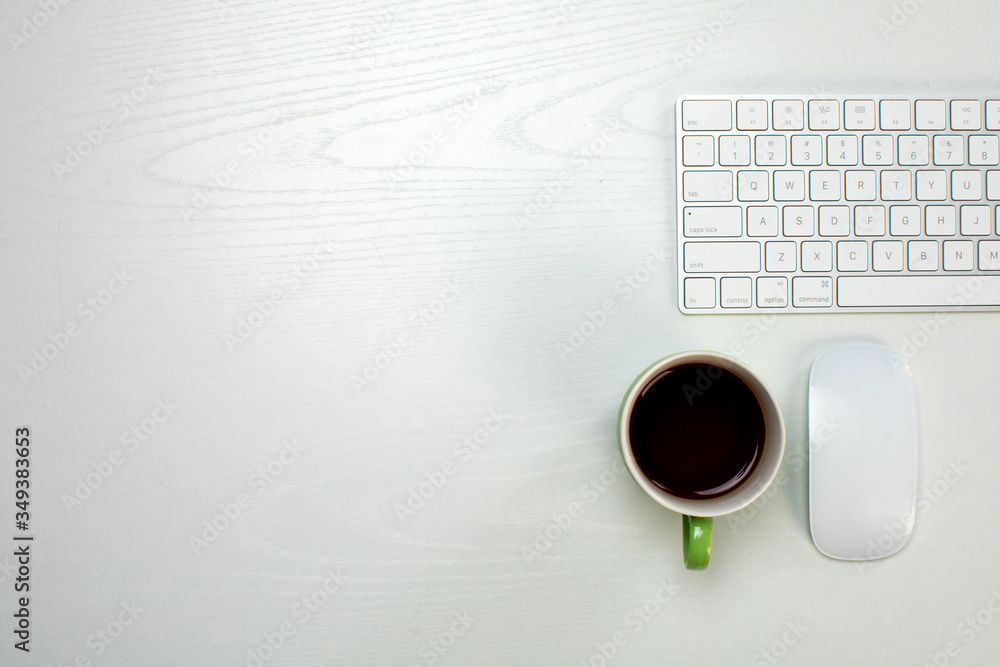 a cup of coffee and wireless keyboard and mouse a cup of coffee and wireless keyboard and mouse