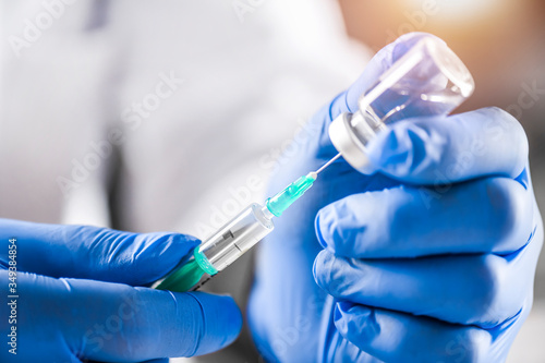 Vaccine dose in dosctor hands, medical concept detail. Vaccination hypodermic injection treatment care in hospital prevention illness or coronavirus