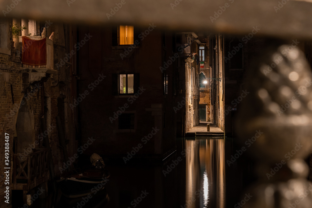 view of a water canal and a beautiful narrow street in Venice Italy view of a water canal and a beautiful narrow street in Venice Italy