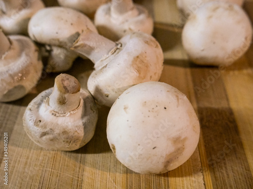 Large mushrooms on wooden table