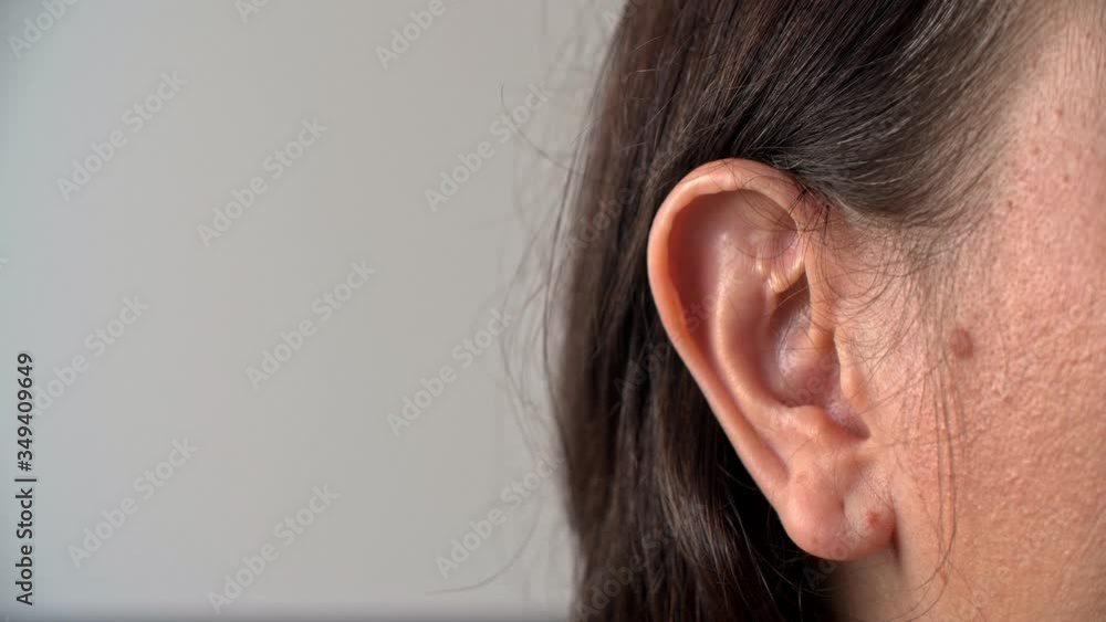 Close up view of human ear. Cropped view of female head with copy space. Hearing concept Close up view of human ear. Cropped view of female head with copy space. Hearing concept