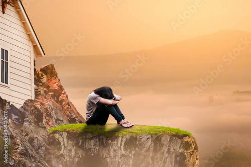 young woman sitting on a rock