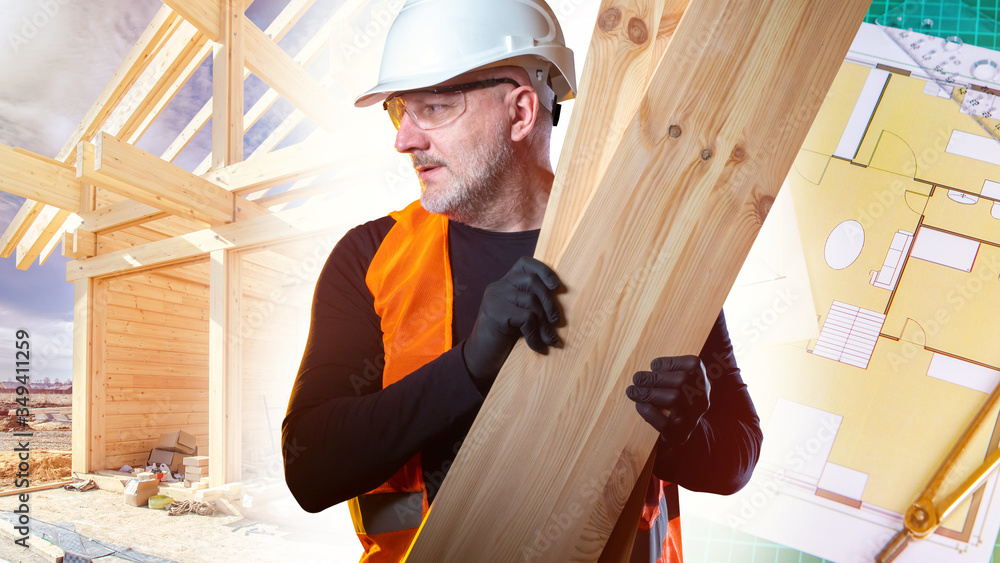 A Builder with planks in his hands next to the frame of the cottage.Delivery of lumber to the construction site. A carpenter working in construction. Woodworking.The house is made of natural materials A Builder with planks in his hands next to the frame of the cottage.Delivery of lumber to the construction site. A carpenter working in construction. Woodworking.The house is made of natural materials