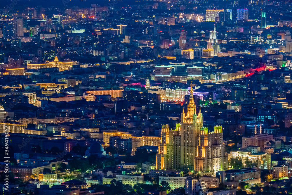 Obraz premium Moscow. Russia. View of night Moscow from a quadrocopter. Evening capital view from the drone. Luminous skyscraper rises above Moscow. Capital of Russia at night. Seven sisters. Tourism to Russia