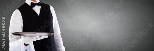 Obraz na plátně Male Waiter Holding Tray