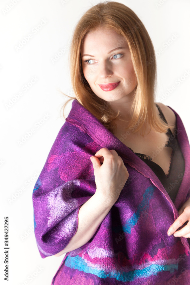 Pretty young caucasian woman designer posing with her felted scarf Pretty young caucasian woman designer posing with her felted scarf