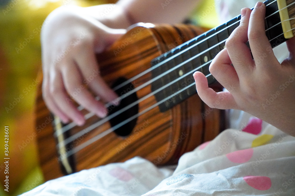 Girls practice playing the classic ukulele,close up,Stay at home
Girls practice playing the classic ukulele,close up,Stay at home