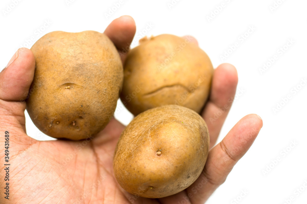Close up potatoes over white background.